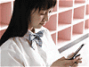 中学生と携帯電話イメージ
